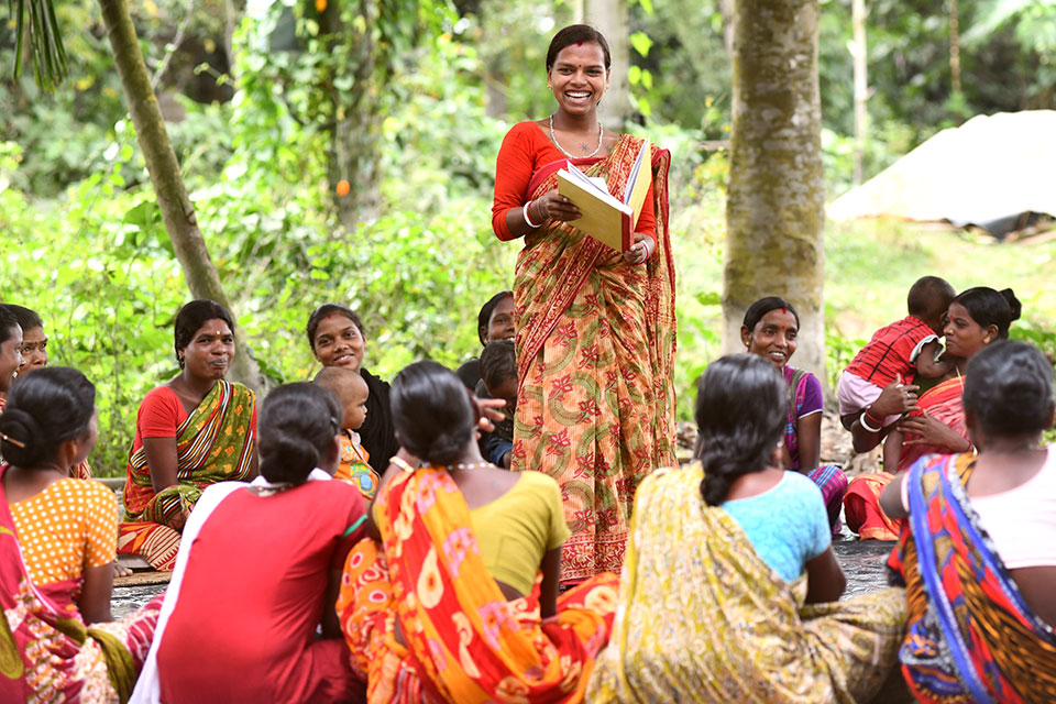 World-changing woman Malti Tudu speaking about to village women during a meeting at Simalbari village in Bihar, India. 
