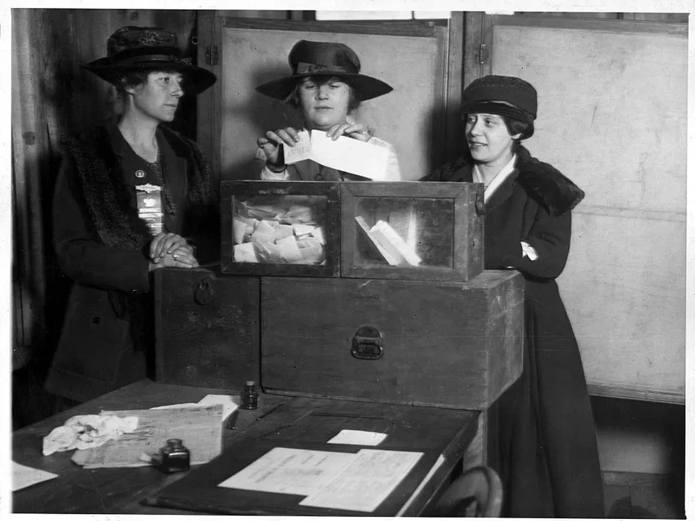 Black and white photo of world-changing women voting for the first time in Wyoming in 1890.